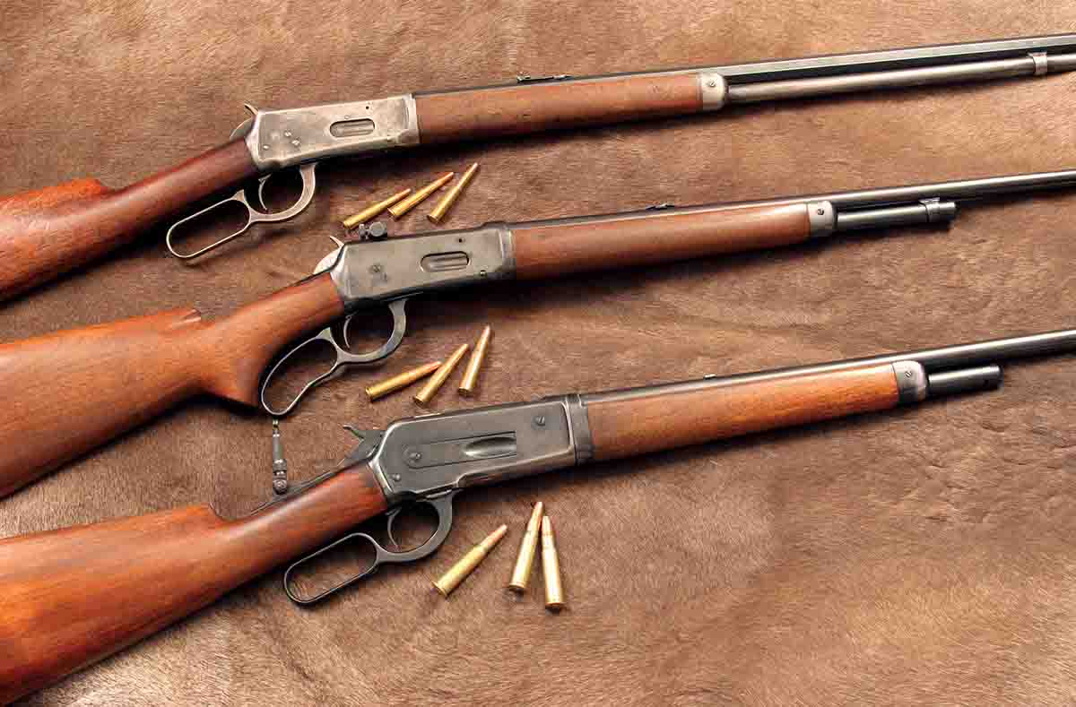 When smokeless lever-action cartridges started appearing in the 1890s, hunters immediately noticed how much flatter they shot than black-powder rounds. These rifles include (top to bottom): a Winchester 1894 .25-35 WCF, Winchester Model 64 .30 WCF and a Winchester 1886 .33 WCF.